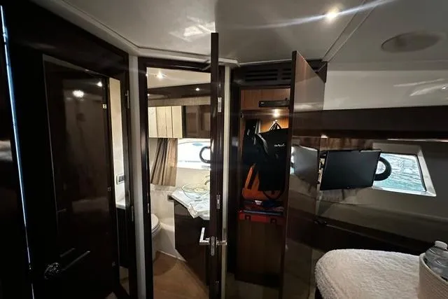 Slide: The Image of Interior of 2017 Sea Ray Sundancer 400 yacht, featuring a cozy cabin with modern amenities. - 26