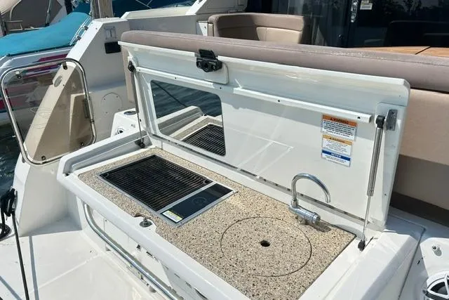 Slide: The Image of Outdoor kitchenette on 2017 Sea Ray Sundancer 400 yacht with grill and sink. - 12