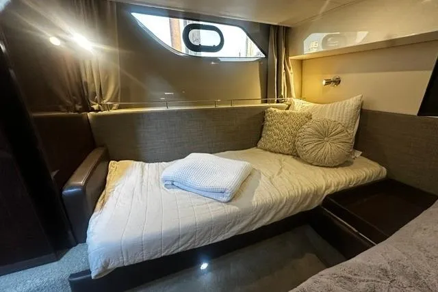 Slide: The Image of Cozy cabin interior of 2017 Sea Ray Sundancer 400 yacht with bed and window view. - 21
