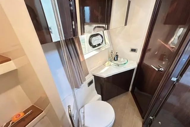 Slide: The Image of Luxurious bathroom in 2017 Sea Ray Sundancer 400 yacht with modern fixtures and elegant design. - 34