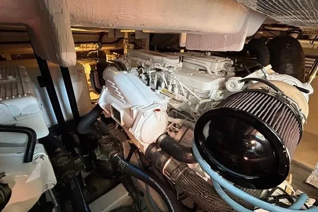 Slide: The Image of Engine room of a 2017 Sea Ray Sundancer 400 yacht, showcasing mechanical components. - 43