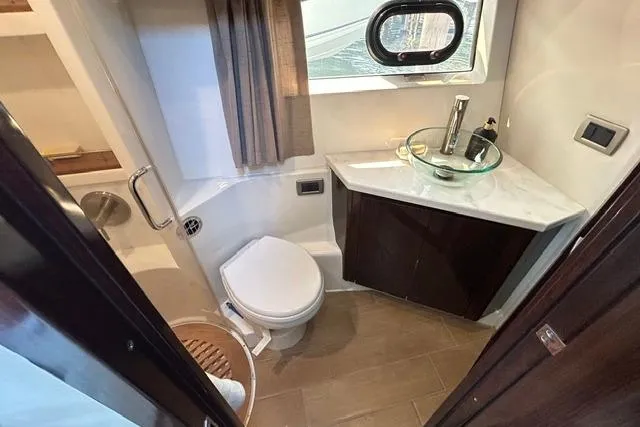 Slide: The Image of Luxurious bathroom in 2017 Sea Ray Sundancer 400 yacht with modern fixtures and elegant design. - 33