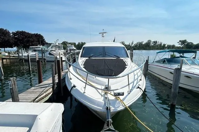 Slide: The Image of 2017 Sea Ray Sundancer 400 yacht docked at a marina on a sunny day. - 4