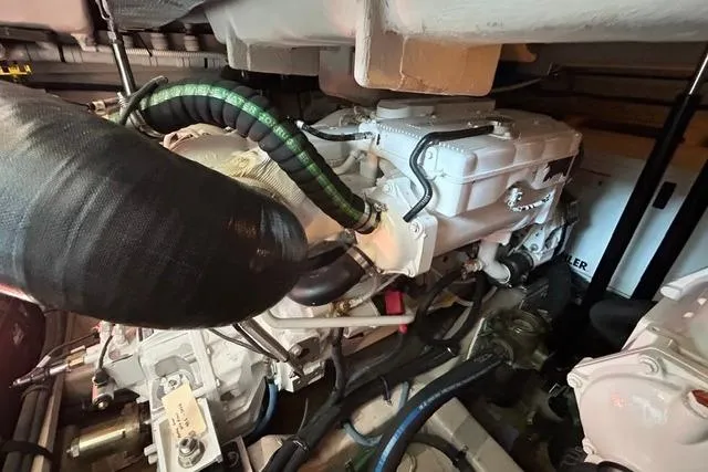 Slide: The Image of Engine compartment of a 2017 Sea Ray Sundancer 400 yacht, showcasing mechanical components. - 44