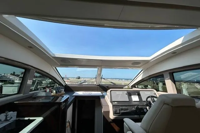 Slide: The Image of Interior view of 2017 Sea Ray Sundancer 400 yacht cockpit with panoramic windows. - 40