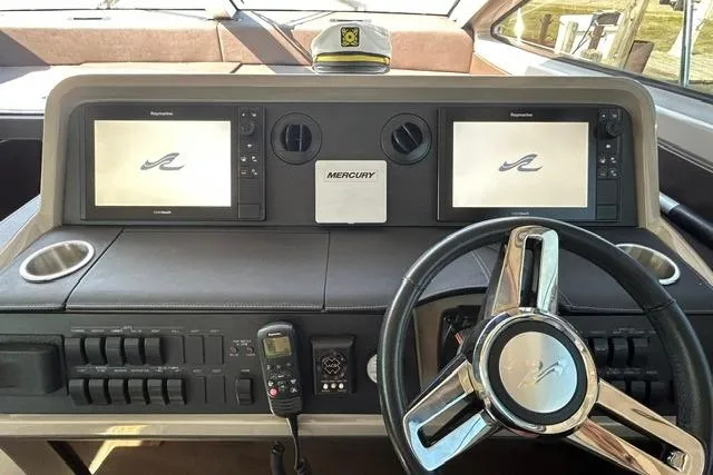 Slide: The Image of Helm of 2017 Sea Ray Sundancer 400 with dual displays and steering wheel. - 38