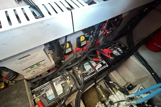 Slide: The Image of Engine room of 2017 Sea Ray Sundancer 400 with batteries and wiring. - 45