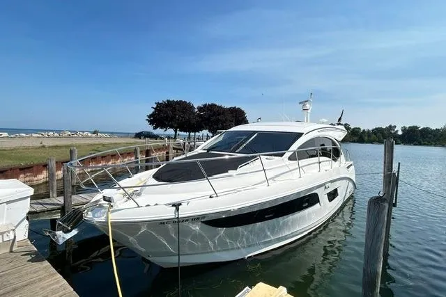 Slide: The Image of 2017 Sea Ray Sundancer 400 yacht docked at a marina on a sunny day. - 5