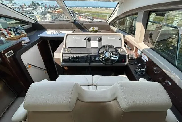 Slide: The Image of Interior helm of 2017 Sea Ray Sundancer 400 yacht with modern controls and seating. - 41