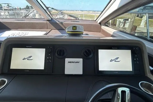 Slide: The Image of Helm of 2017 Sea Ray Sundancer 400 with dual displays and captain's hat. - 37