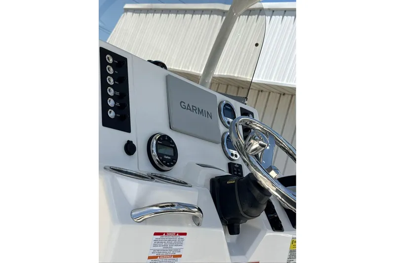 Slide: The Image of 2021 Robalo R180 Center Console dashboard with Garmin navigation system and controls. - 5