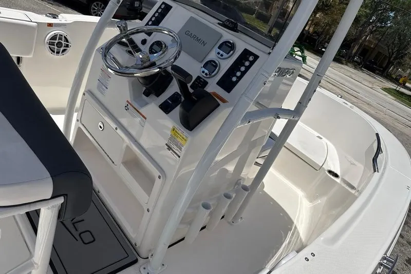 Slide: The Image of 2021 Robalo R180 Center Console boat interior with steering wheel and controls. - 4