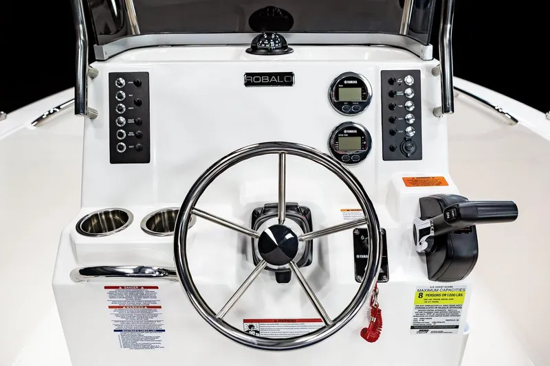 Slide: The Image of Manufacturer Provided Image: 2021 Robalo R180 Center Console boat dashboard with steering wheel and controls. - 23