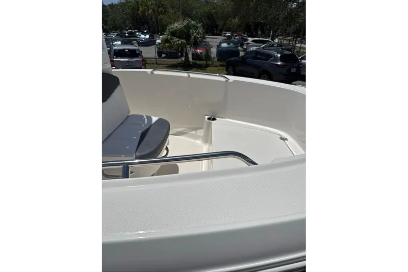 Slide: The Image of 2021 Robalo R180 Center Console boat interior with seating and railing. - 10