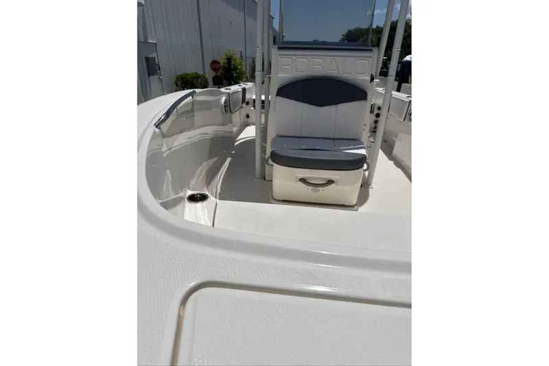 Slide: The Image of 2021 Robalo R180 Center Console boat interior with seating and storage. - 11