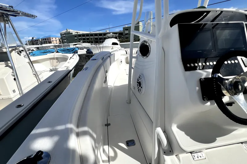 Slide: The Image of 2001 Wellcraft 29 Scarab boat interior with steering wheel and control panel. - 76