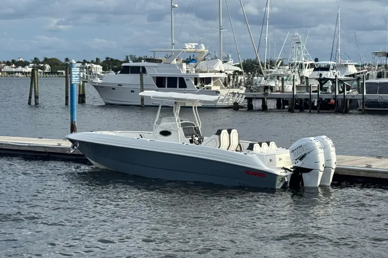 The Image of 2001 Wellcraft 29 Scarab boat docked at marina with twin outboard engines. - 12