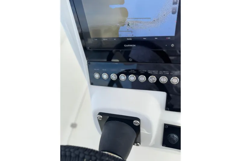 Slide: The Image of Control panel of a 2001 Wellcraft 29 Scarab boat with Garmin display. - 10
