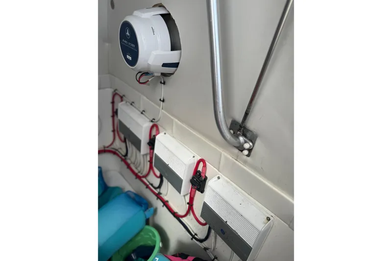 Slide: The Image of Electrical system inside a 2001 Wellcraft 29 Scarab boat, featuring wiring and components. - 13