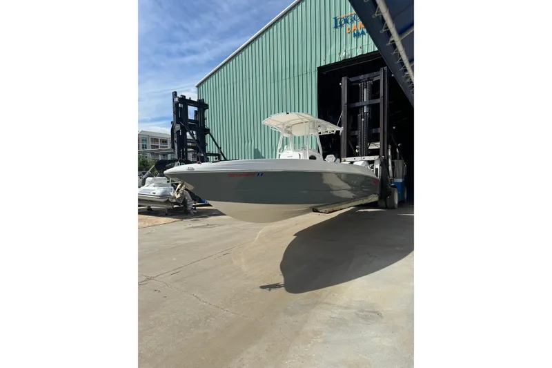 Slide: The Image of 2001 Wellcraft 29 Scarab boat in dry dock, ready for maintenance or storage. - 3