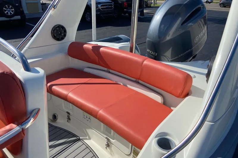 Slide: The Image of 2019 Brig Eagle 650 boat interior with red seating and Yamaha engine. - 5