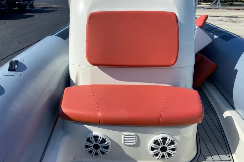 Slide: The Image of 2019 Brig Eagle 650 boat with red seating and built-in speakers. - 18