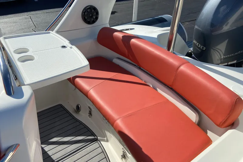 Slide: The Image of 2019 Brig Eagle 650 boat interior with red seating and white table. - 6