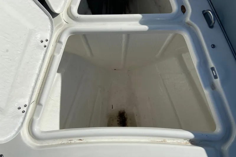 Slide: The Image of Open storage compartment on a 2019 Brig Eagle 650 boat, showing interior space. - 16