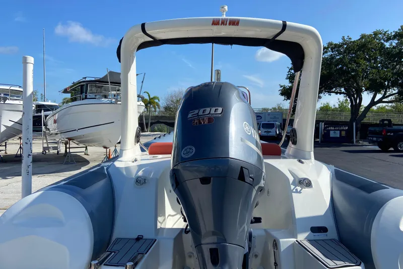 Slide: The Image of 2019 Brig Eagle 650 boat with Yamaha 200 HP engine, docked outdoors. - 4