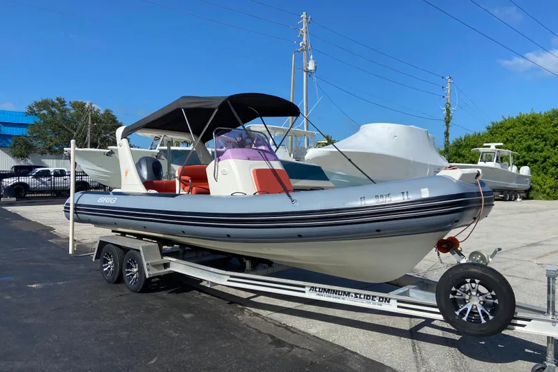 Slide: The Image of 2019 Brig Eagle 650 boat on trailer, parked outdoors under clear sky. - 2