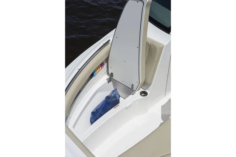 Slide: The Image of Manufacturer Provided Image: 2021 Pursuit DC 235 Dual Console storage compartment with open lid. - 17