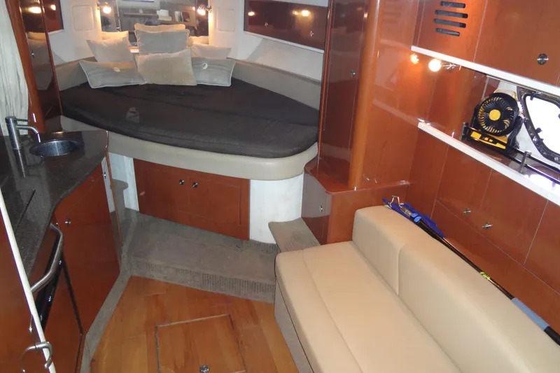 Slide: The Image of Interior of 2013 Sea Ray Sundancer 330 yacht with cozy seating and modern amenities. - 38