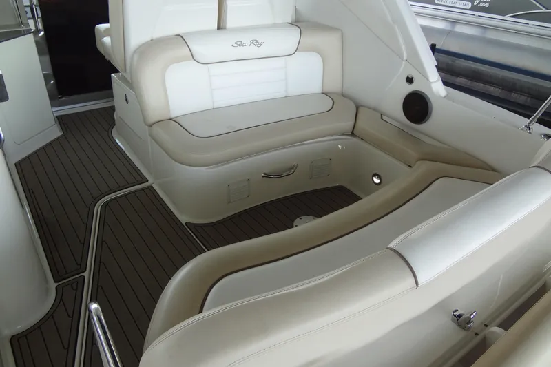 Slide: The Image of Interior seating of 2013 Sea Ray Sundancer 330 yacht with beige and white upholstery. - 18