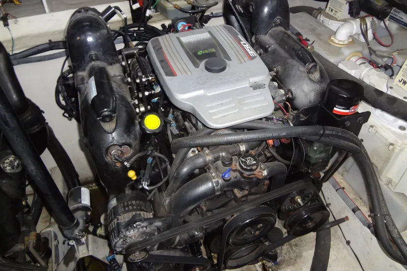 Slide: The Image of Engine compartment of a 2013 Sea Ray Sundancer 330 boat, showcasing mechanical components. - 61