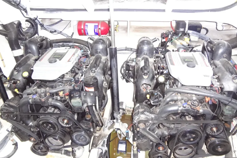 Slide: The Image of Twin engines in a 2013 Sea Ray Sundancer 330 boat engine compartment. - 57