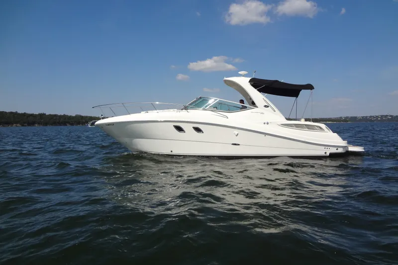 Slide: The Image of 2013 Sea Ray Sundancer 330 yacht cruising on a sunny day. - 8