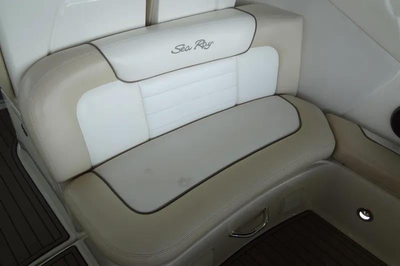 Slide: The Image of 2013 Sea Ray Sundancer 330 boat seating with beige and white upholstery. - 21