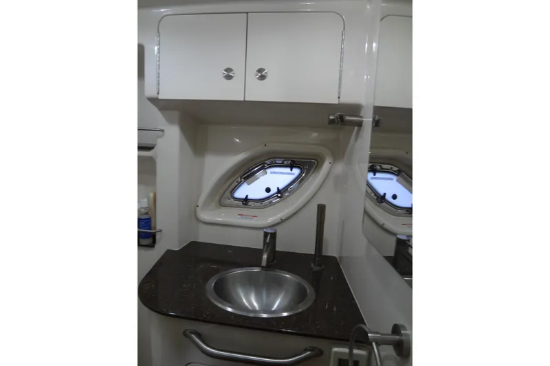 Slide: The Image of Bathroom interior of 2013 Sea Ray Sundancer 330 yacht with sink and porthole window. - 54
