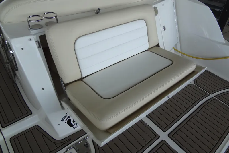 Slide: The Image of 2013 Sea Ray Sundancer 330 boat seat with beige and white upholstery. - 17
