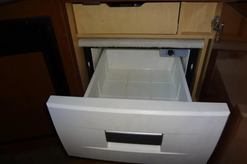 Slide: The Image of Open drawer in 2013 Sea Ray Sundancer 330 yacht interior. - 45
