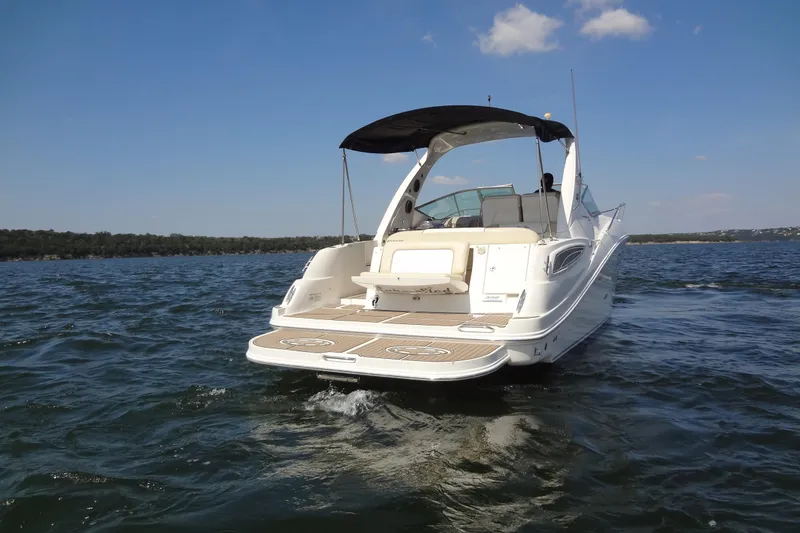 Slide: The Image of 2013 Sea Ray Sundancer 330 cruising on open water under a clear blue sky. - 4