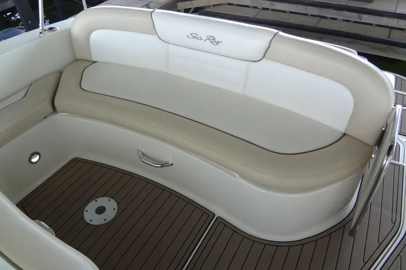 Slide: The Image of 2013 Sea Ray Sundancer 330 boat interior with beige seating and wood-style flooring. - 20