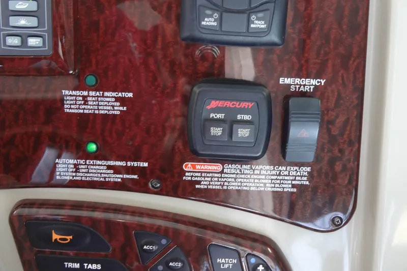 Slide: The Image of Control panel of a 2013 Sea Ray Sundancer 330 boat with emergency start and safety indicators. - 30