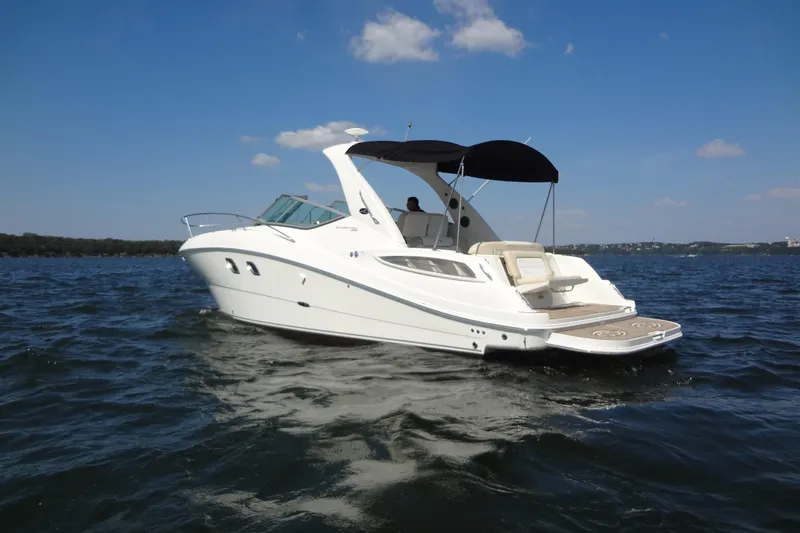 Slide: The Image of 2013 Sea Ray Sundancer 330 cruising on a sunny day with clear skies. - 6