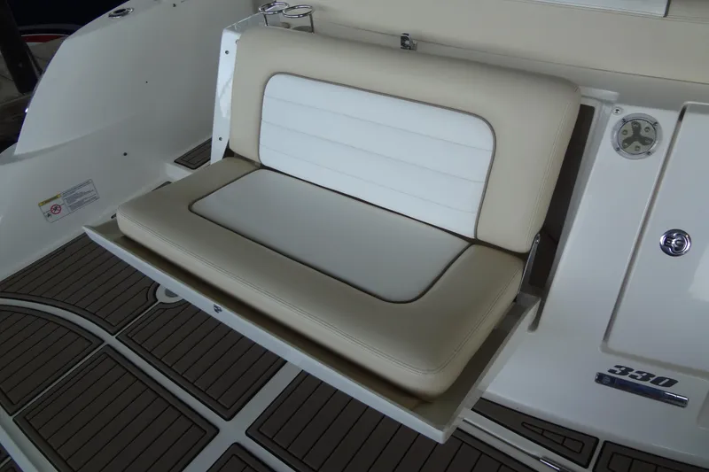 Slide: The Image of 2013 Sea Ray Sundancer 330 boat seat with beige and white upholstery. - 16
