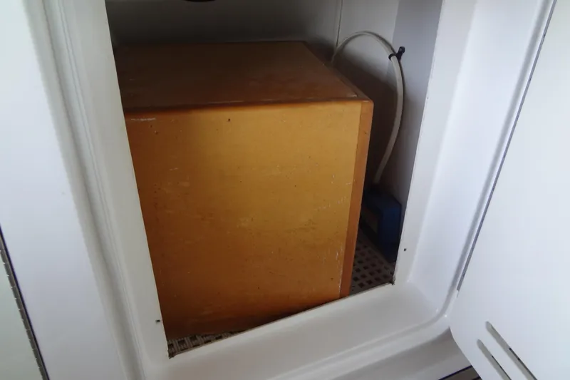 Slide: The Image of Storage compartment inside a 2013 Sea Ray Sundancer 330 boat. - 56
