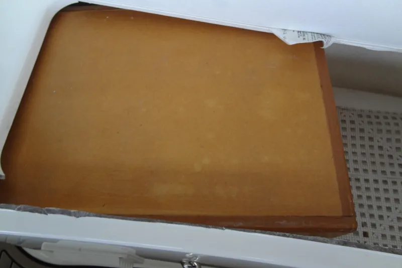 Slide: The Image of Storage compartment in a 2013 Sea Ray Sundancer 330 boat. - 55