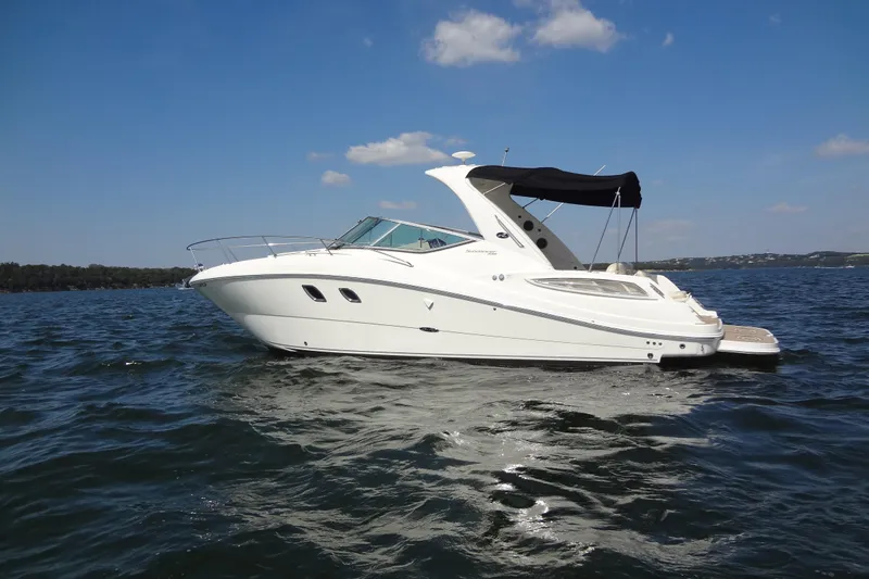 Slide: The Image of 2013 Sea Ray Sundancer 330 yacht cruising on a sunny day in open waters. - 7