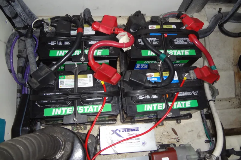 Slide: The Image of Battery setup in a 2013 Sea Ray Sundancer 330 boat engine compartment. - 59