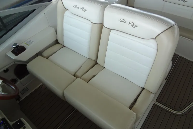 Slide: The Image of 2013 Sea Ray Sundancer 330 boat interior with beige and white seating. - 24